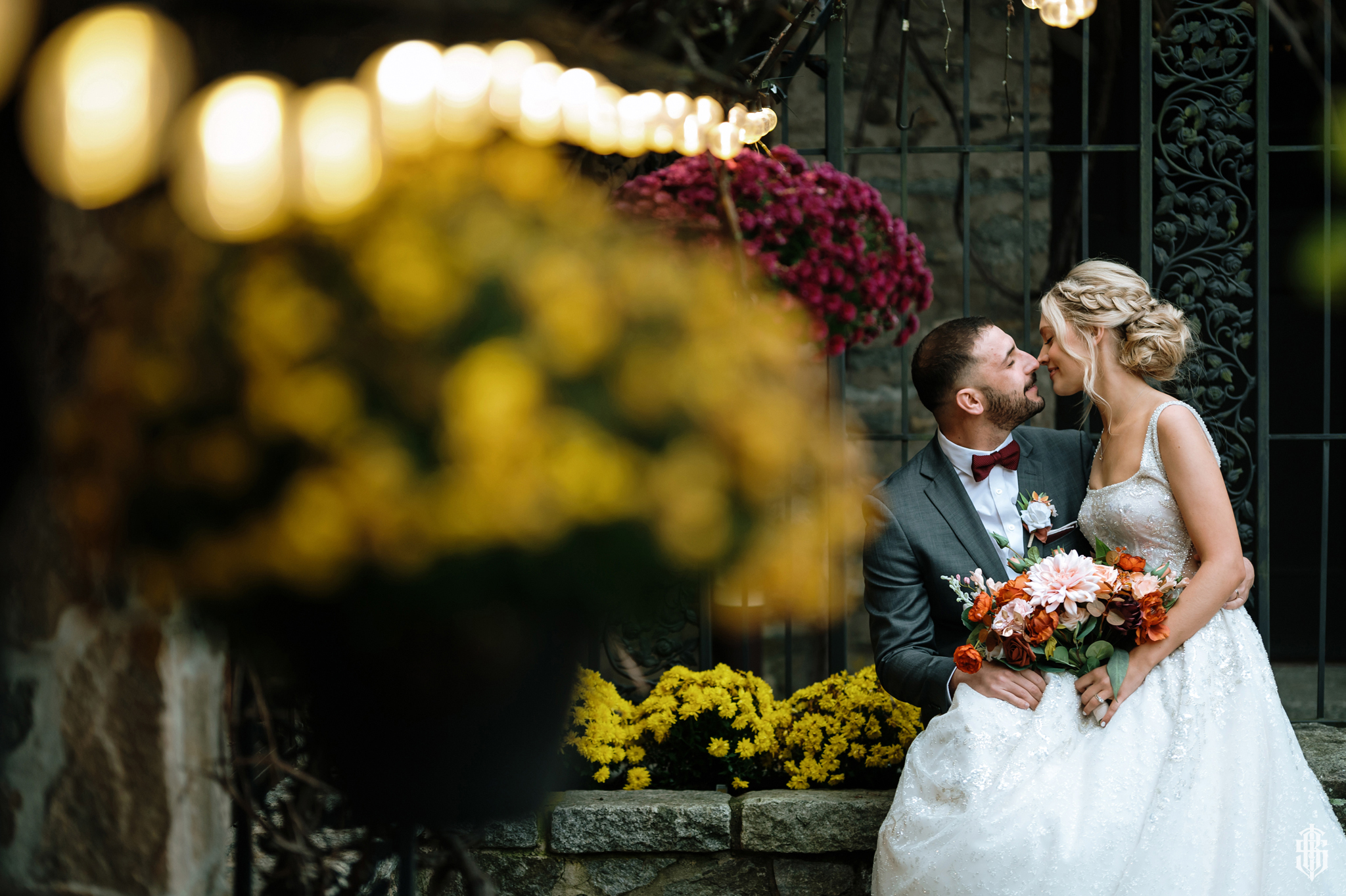 Couple walking through autumn foliage at a fall Connecticut wedding ceremony, a popular 2026 wedding trend - St. Clement's Castle - Bruno Sauma Photographer