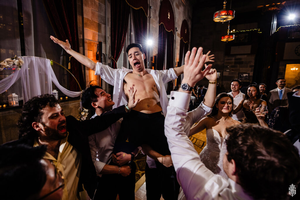 Reception celebration at The Society Room of Hartford, an example of 2026 wedding trends toward semi-formal style - Bruno Sauma Photography