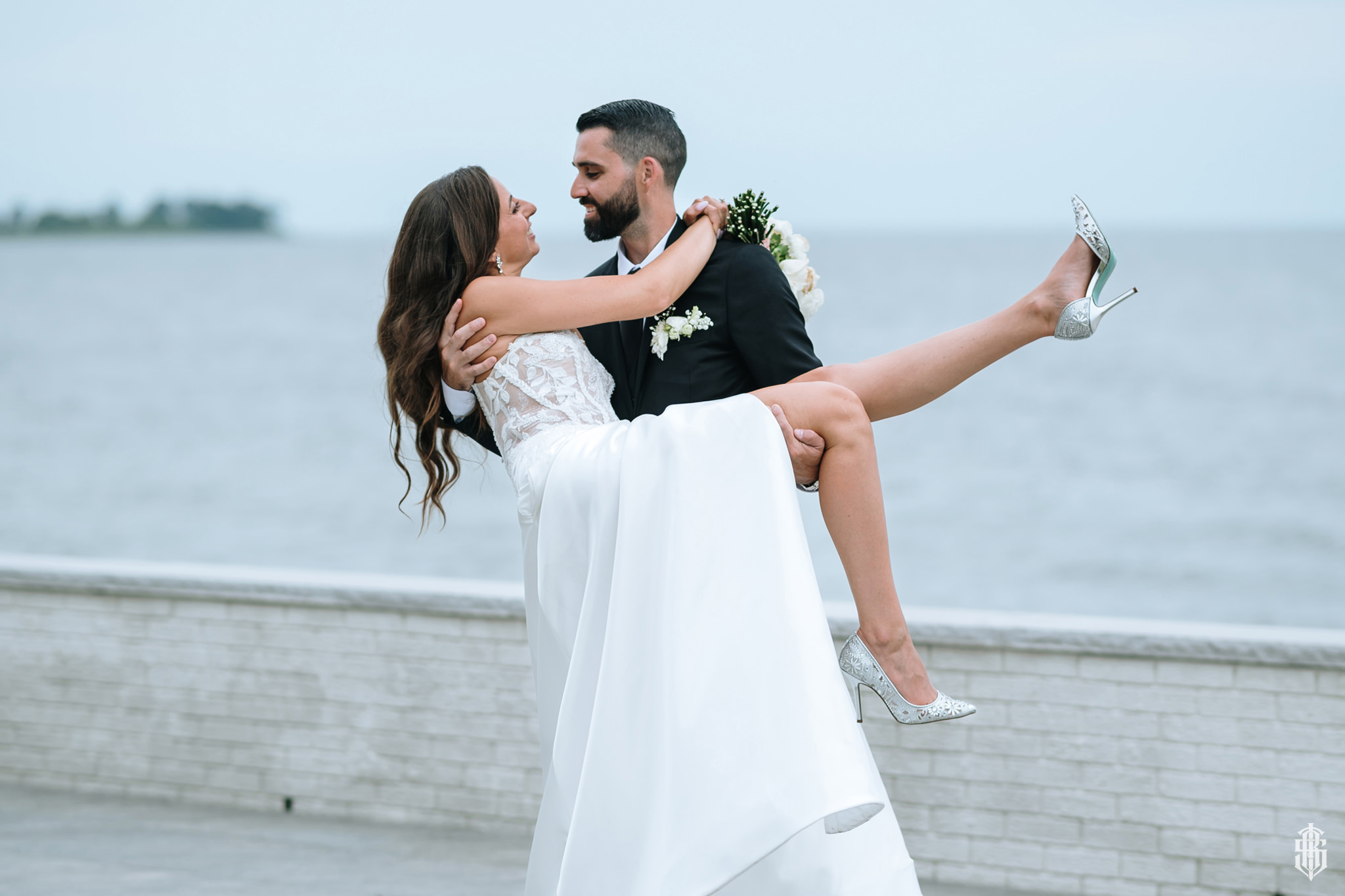 Wind catching the veil during an outdoor portrait on the waterfront