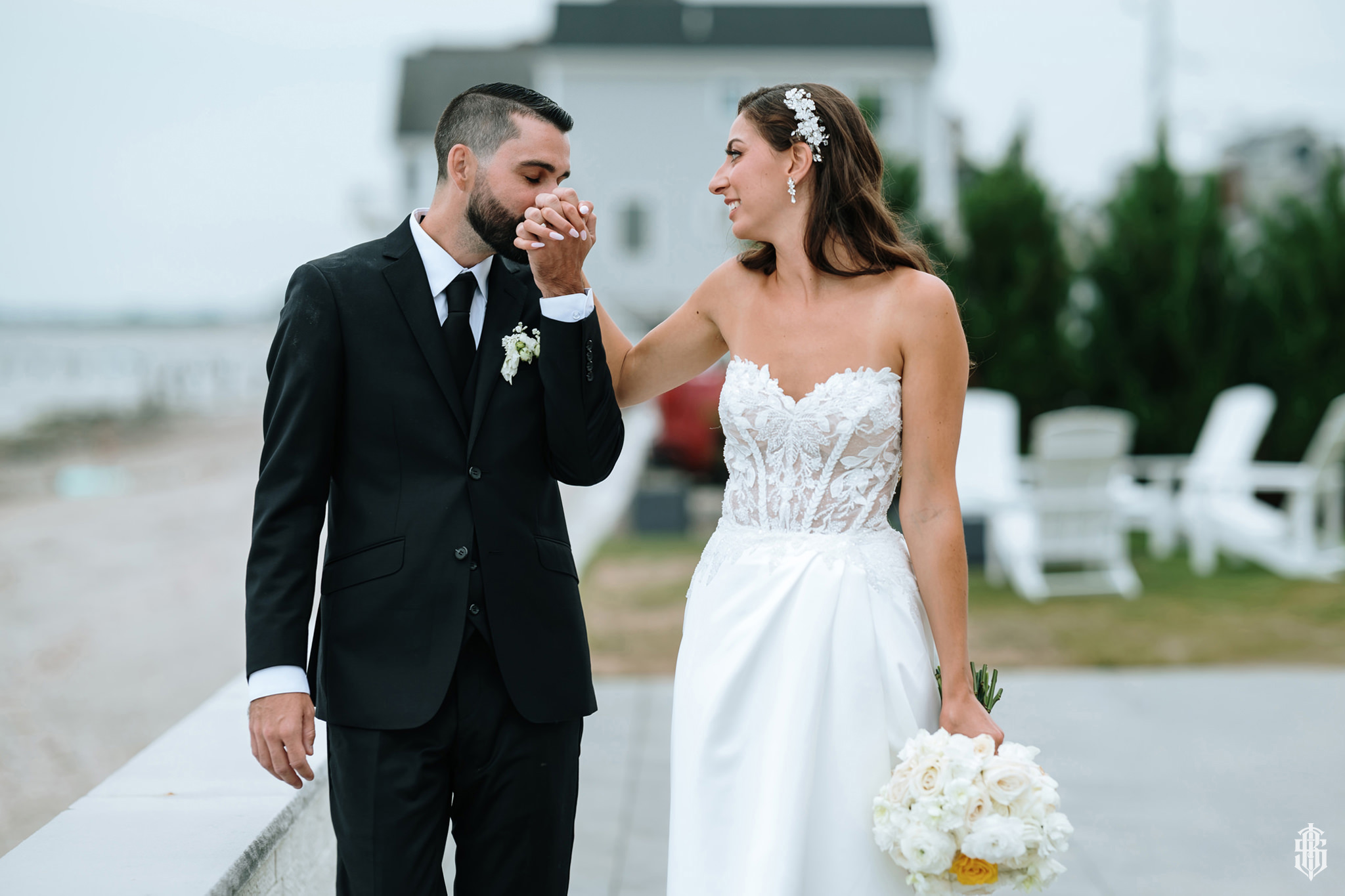 Bride in the getting-ready suite with natural window light and clean modern decor