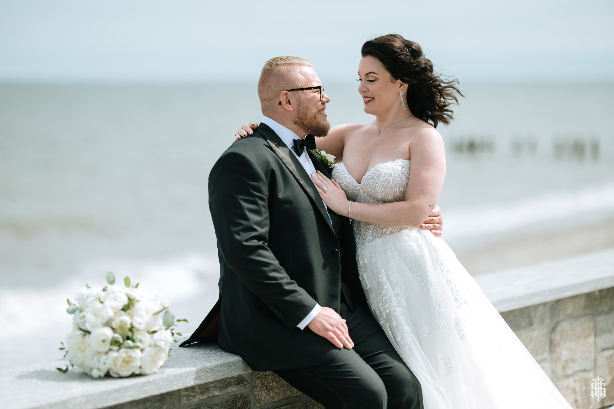 Modern coastal architecture and floor-to-ceiling windows at the venue entrance