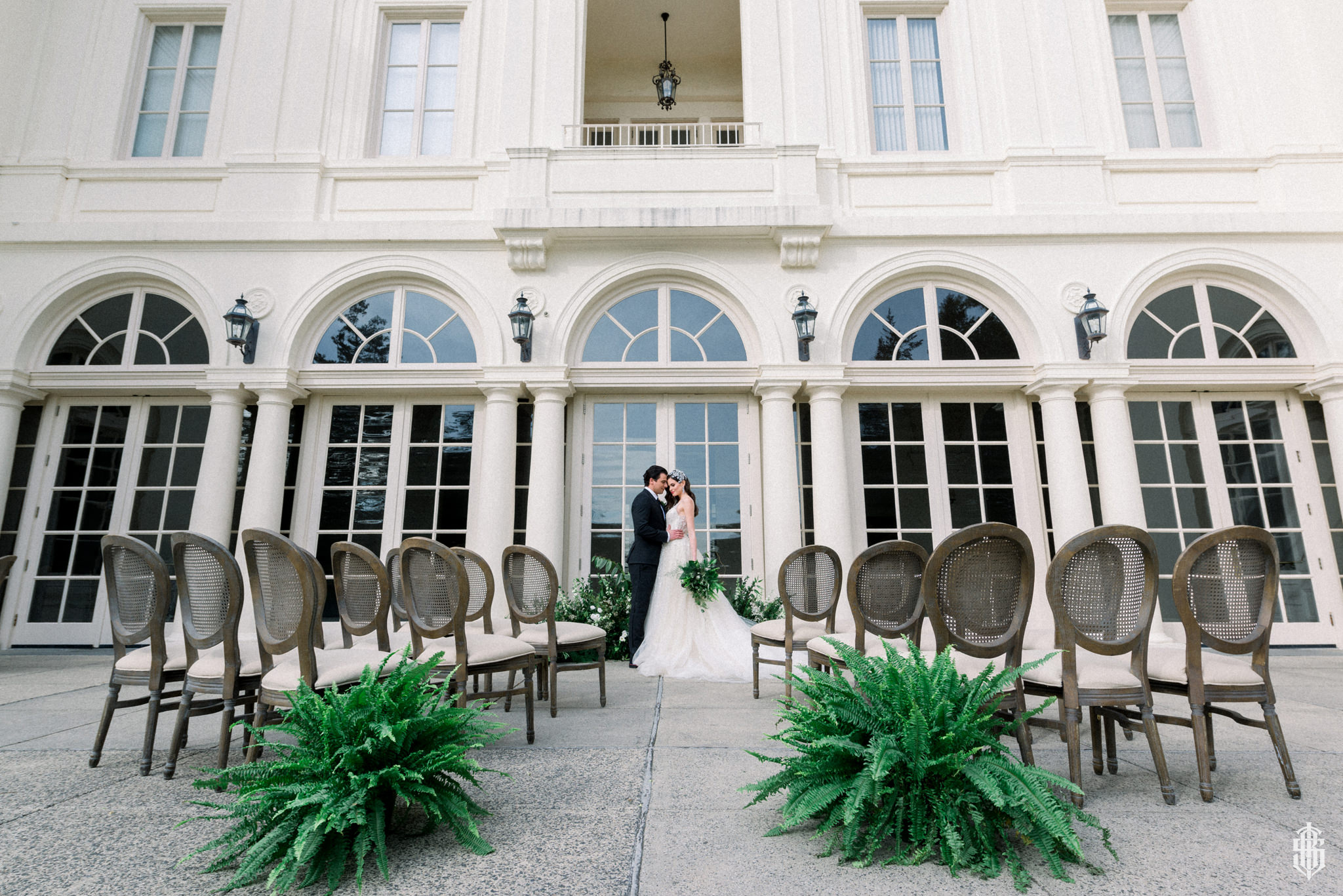 Bride and groom sharing a quiet moment on the sweeping Vista lawn