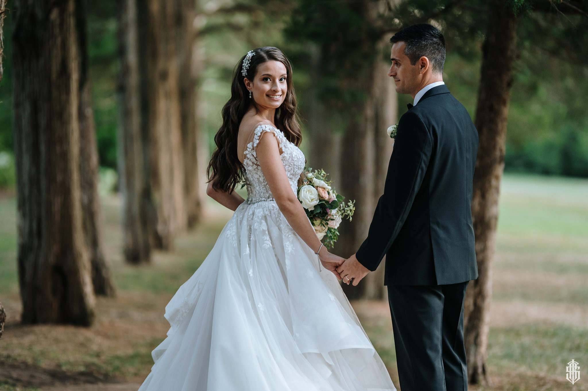 Bride walking along the Maple Allée in soft afternoon light