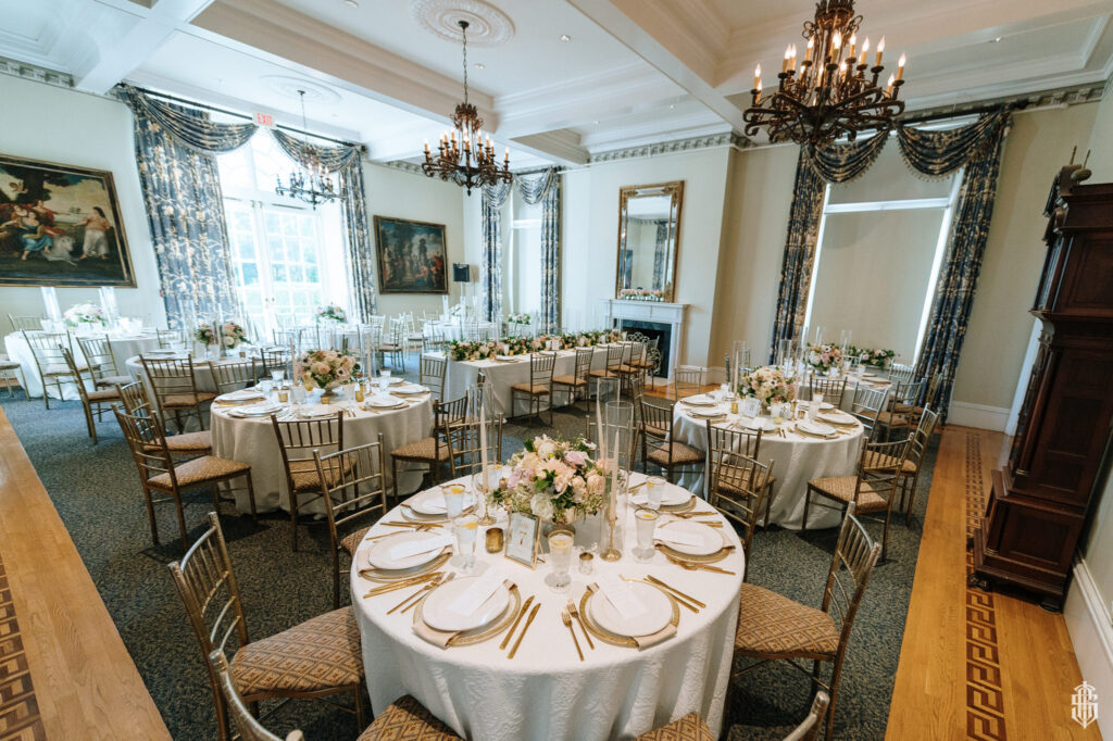 Elegant ballroom reception with tall ceilings and polished floors