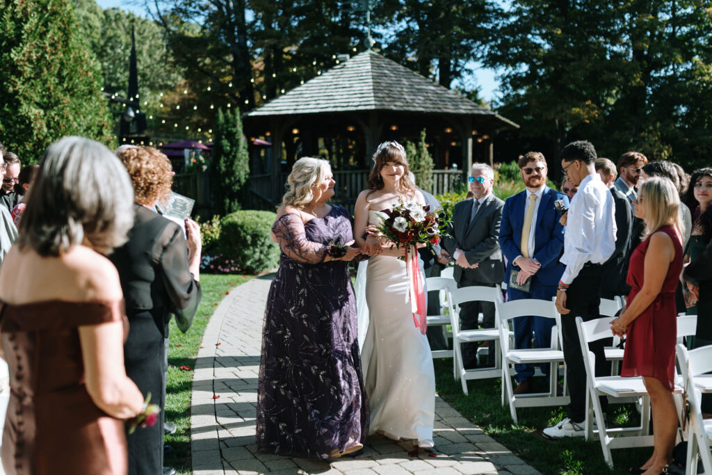 Bride and her mom walking down the aisle at Bill Miller's Castle ceremony, Bruno Sauma photography 
