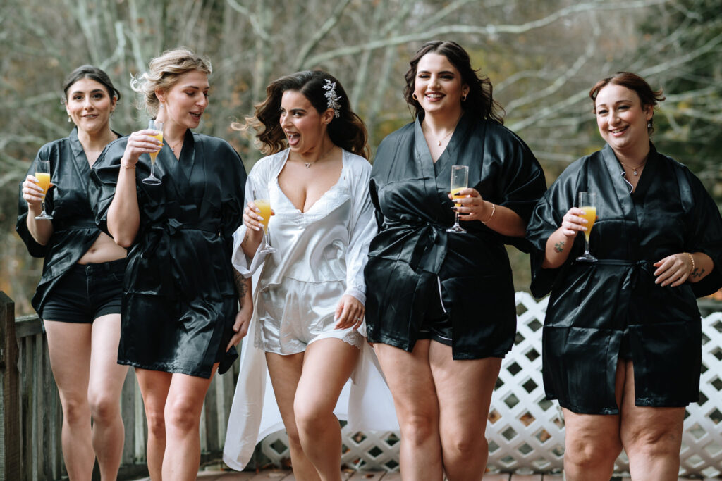 Bridal party having fun on robes at Bill Miller's Castle - Bruno Sauma Photography 