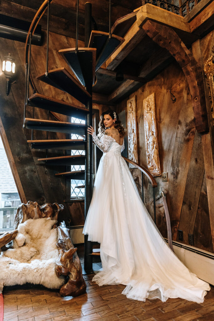 Editorial style picture of the bride at the stairs inside Bridal Suite at Bill Miller's Castle - Bruno Sauma Photography 