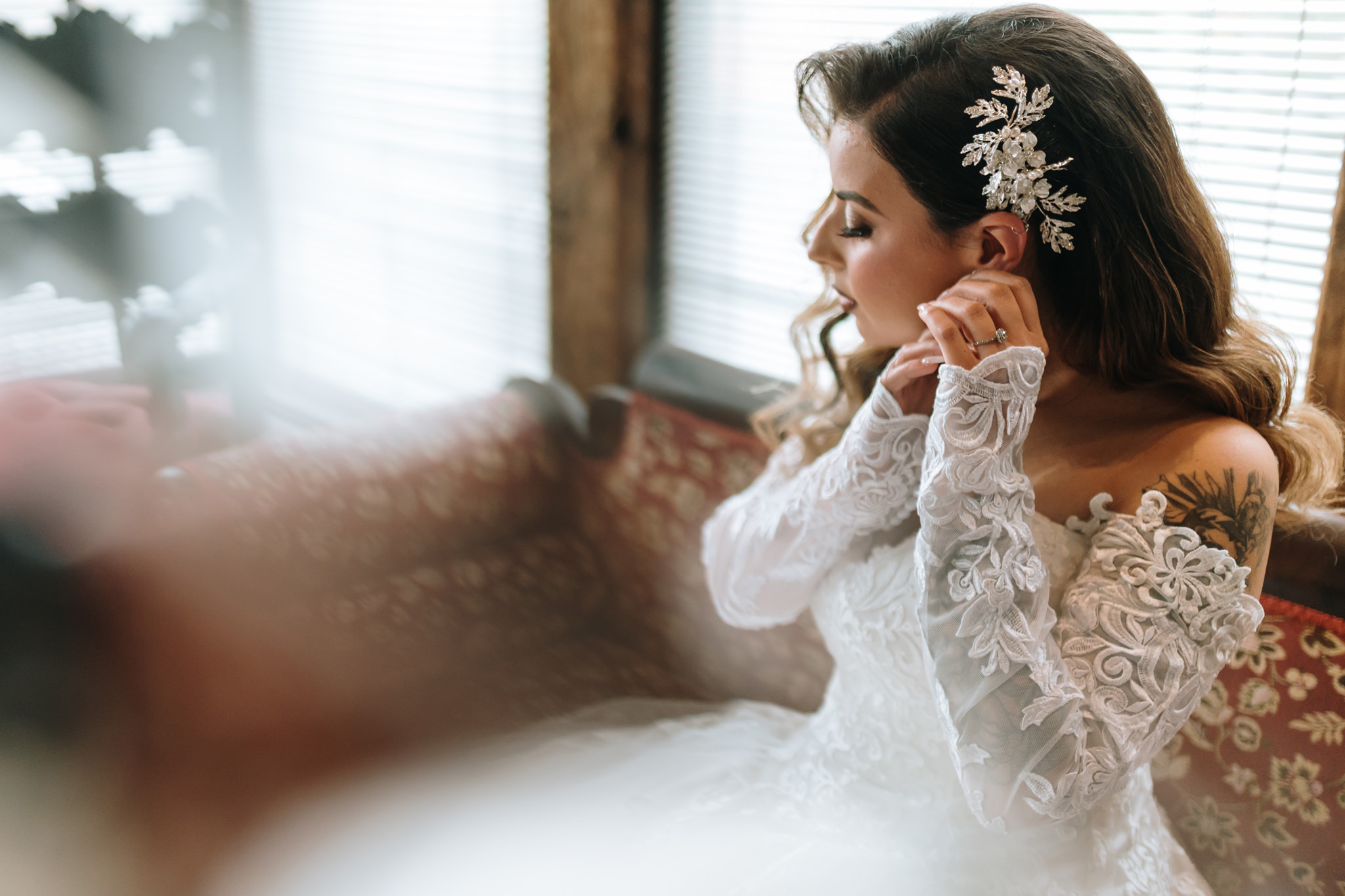 Bride putting her earrings, getting ready pictures at Bill Miller's Castle bridal suite - Bruno Sauma photography