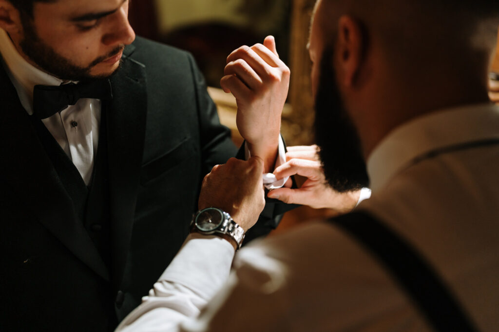 Groom getting ready at the bridal suite of Bill Miller's Castle - Bruno Sauma Photography 