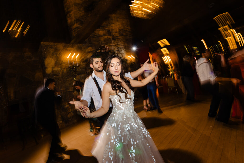 Bride having fun during the reception at Bill Miller's Castle wedding - Bruno Sauma Photography 