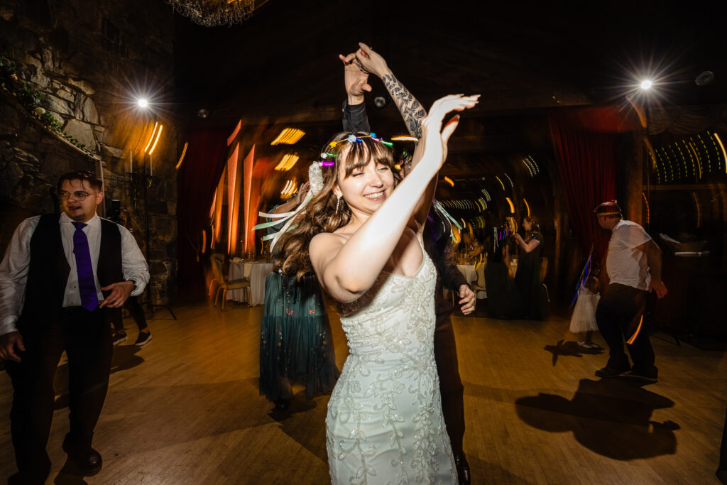 Bride having fun during the reception at Bill Miller's Castle wedding - Bruno Sauma Photography 